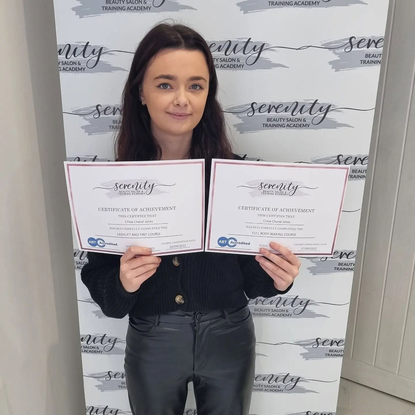A Serenity Training Academy graduate with her certificate
