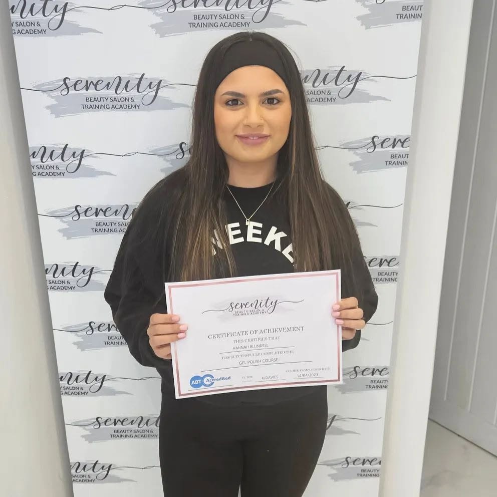 A Serenity Training Academy graduate with her certificate